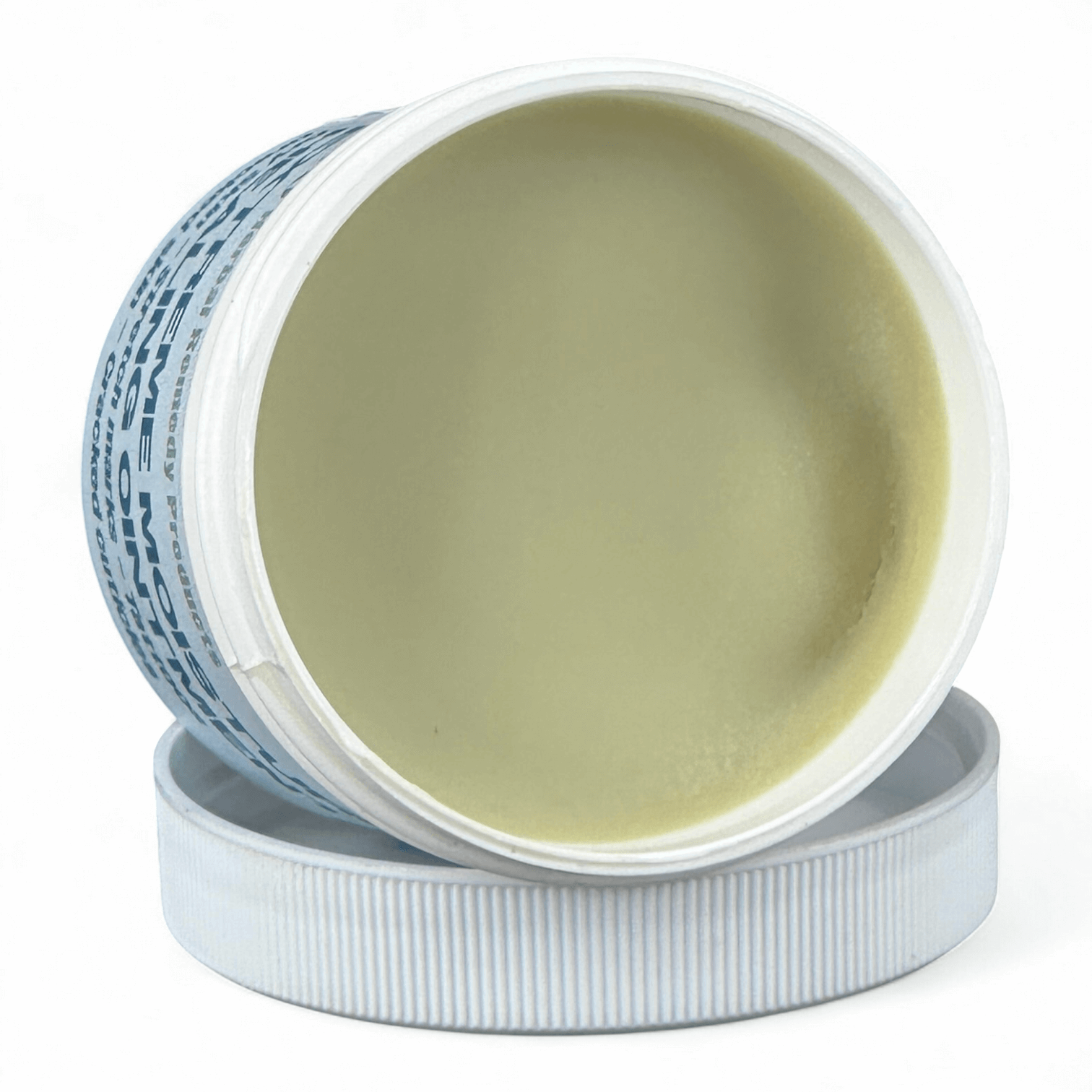 Open jar of cream with visible label on a white background